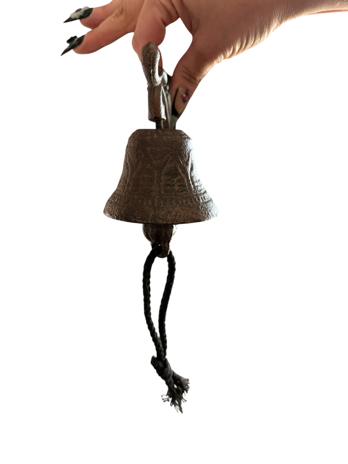 Chica Mexico rustic cast iron wall-mounted bell with a black rope pull and weathered antique finish