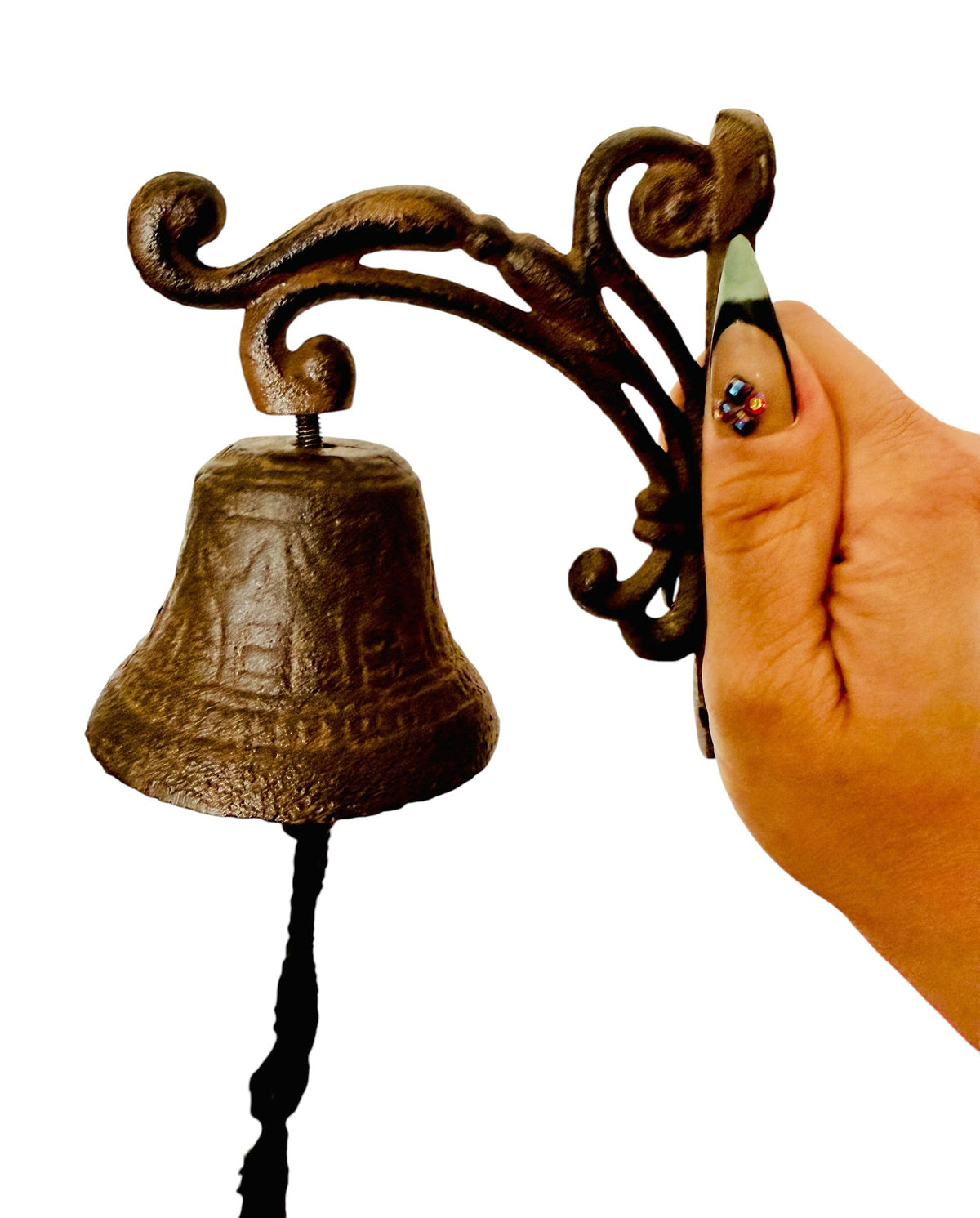 Chica Mexico rustic cast iron wall-mounted bell with an ornate scrolled bracket and a black rope pull for entryways.
