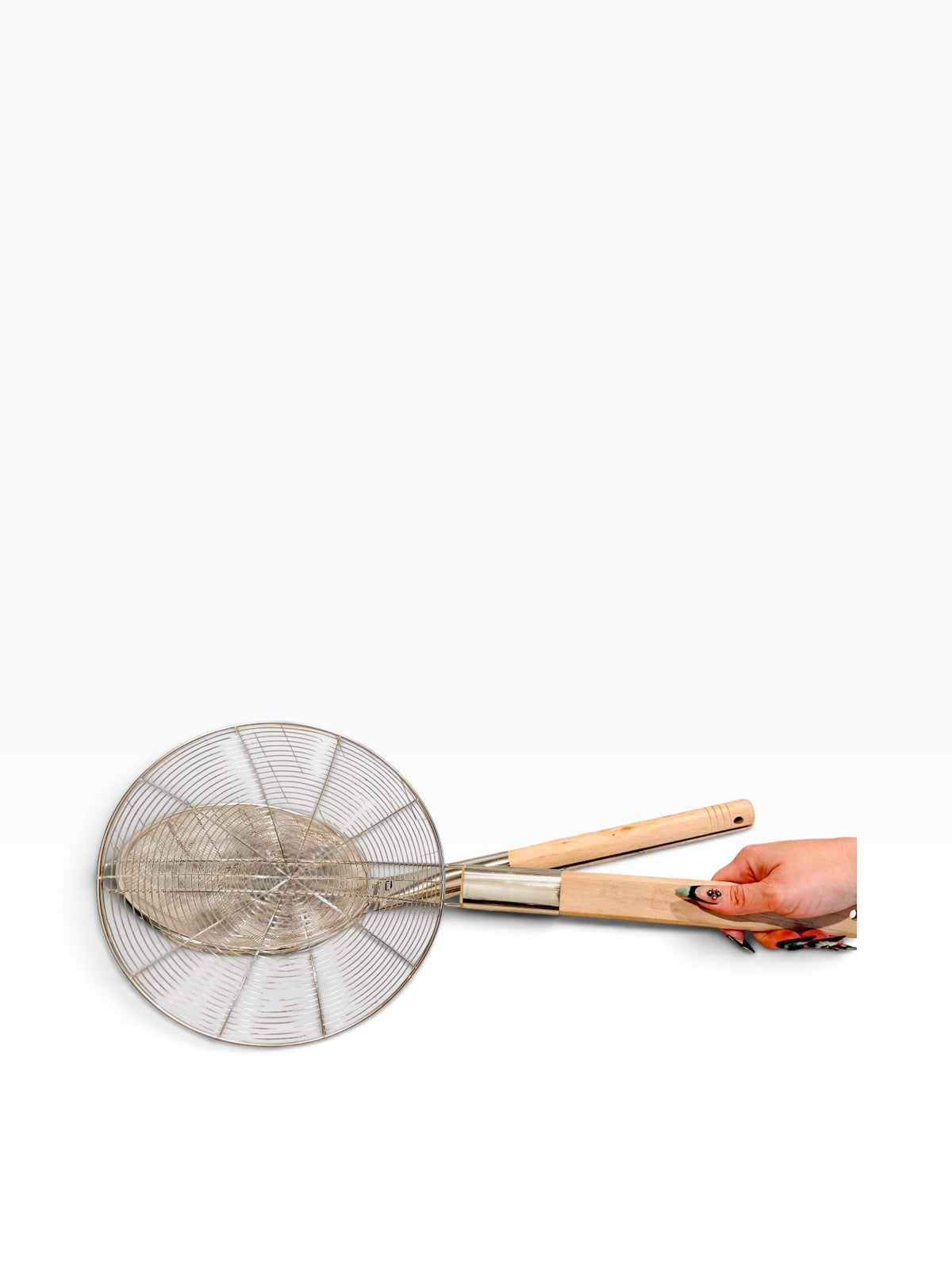 Chica Mexico stainless steel mesh skimmers with natural wooden handles held by a hand against a white background